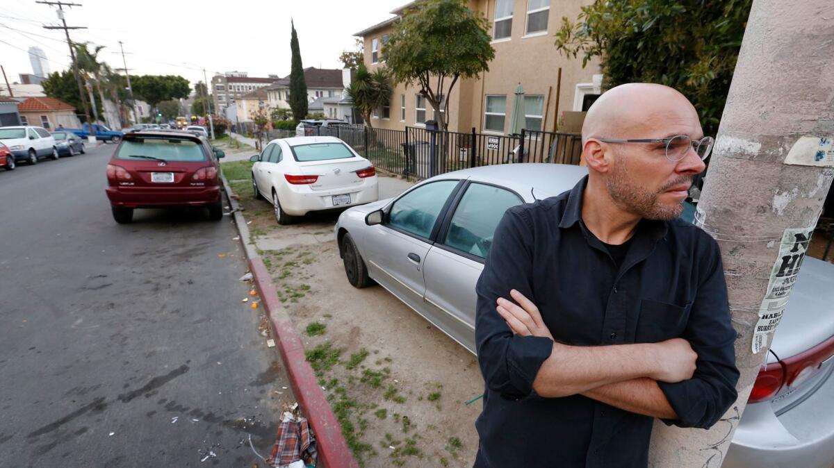 Stephen Sedalis at the corner of Witmer Street and Miramar Street in the Westlake neighborhood, where a growing number of residents park their cars on parkways.