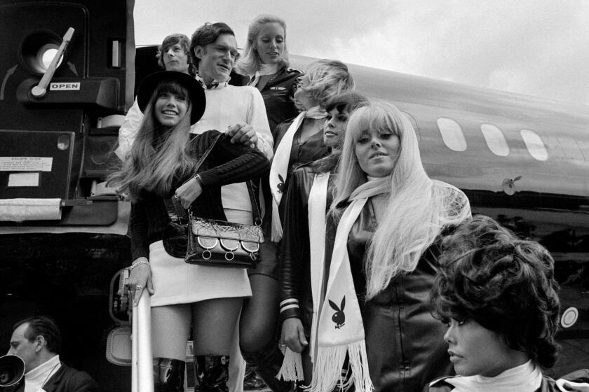 (FILES) This file photo taken on August 21, 1970 shows shows US Playboy Magazine publisher Hugh Hefner (top center), his girlfriend actress Barbara Benton (L) and film director Roman Polanski (top left) arriving at Le Bourget airport with the Playboy jet "Big Bunny". Playboy founder Hugh Hefner has died at age 91, the magazine announced Wednesday, September 27, 2017. / AFP PHOTO / STAFFSTAFF/AFP/Getty Images ** OUTS - ELSENT, FPG, CM - OUTS * NM, PH, VA if sourced by CT, LA or MoD **