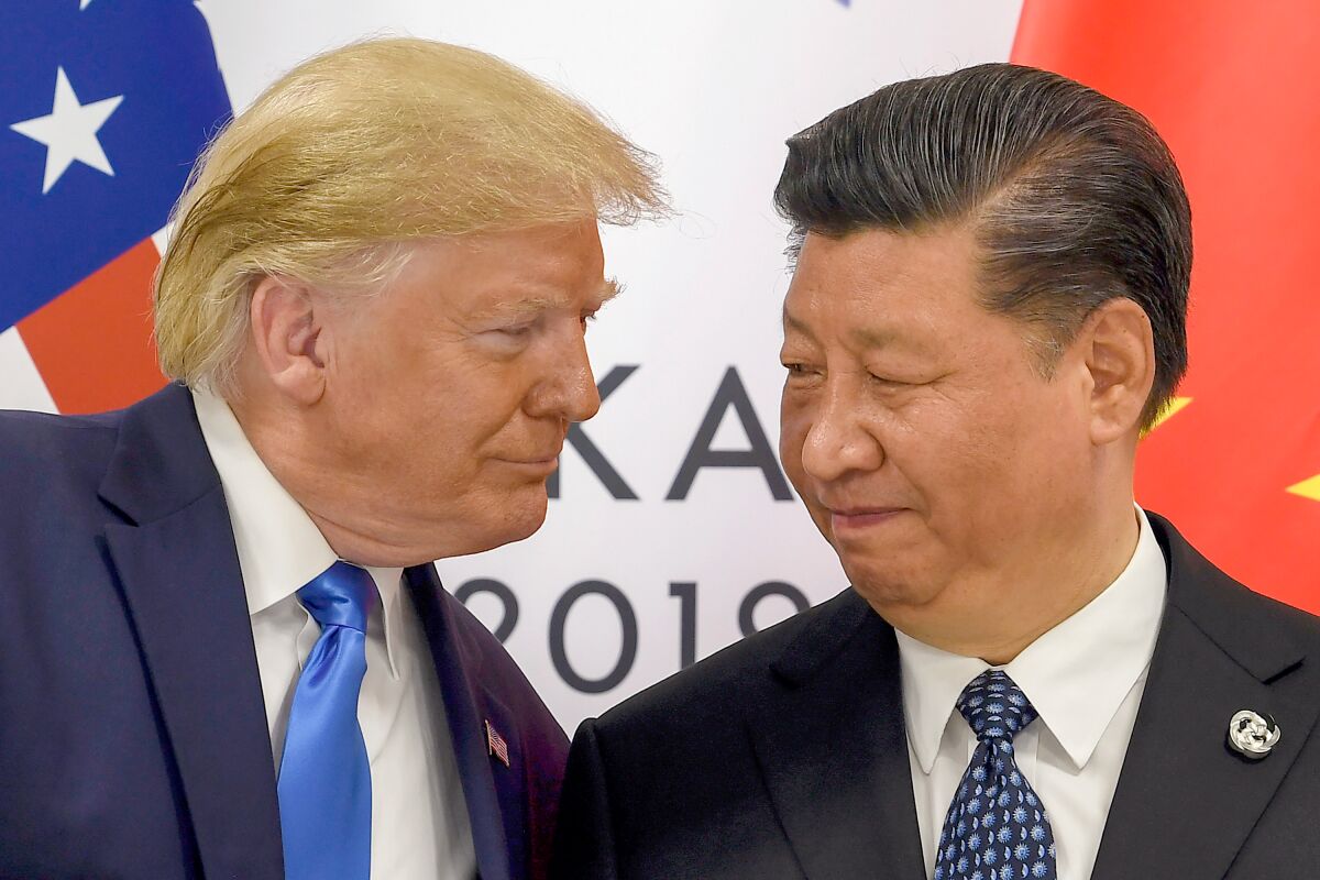 Ex presidente Trump con presidente chino Xi Jinping, cumbre G-20 Osaka, Japón 
