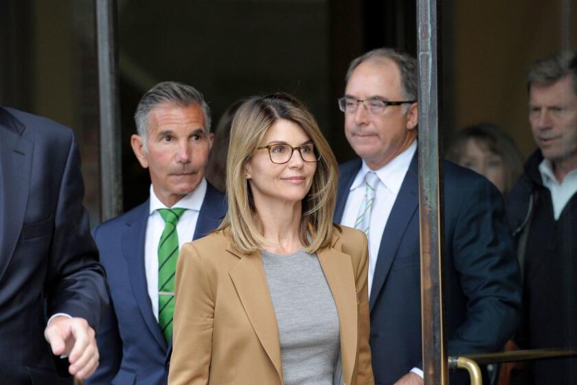 Actress Lori Loughlin exits the courthouse after facing charges for allegedly conspiring to commit mail fraud and other charges in the college admissions scandal at the John Joseph Moakley United States Courthouse in Boston on April 3, 2019. (Photo by Joseph Prezioso / AFP)JOSEPH PREZIOSO/AFP/Getty Images ** OUTS - ELSENT, FPG, CM - OUTS * NM, PH, VA if sourced by CT, LA or MoD **