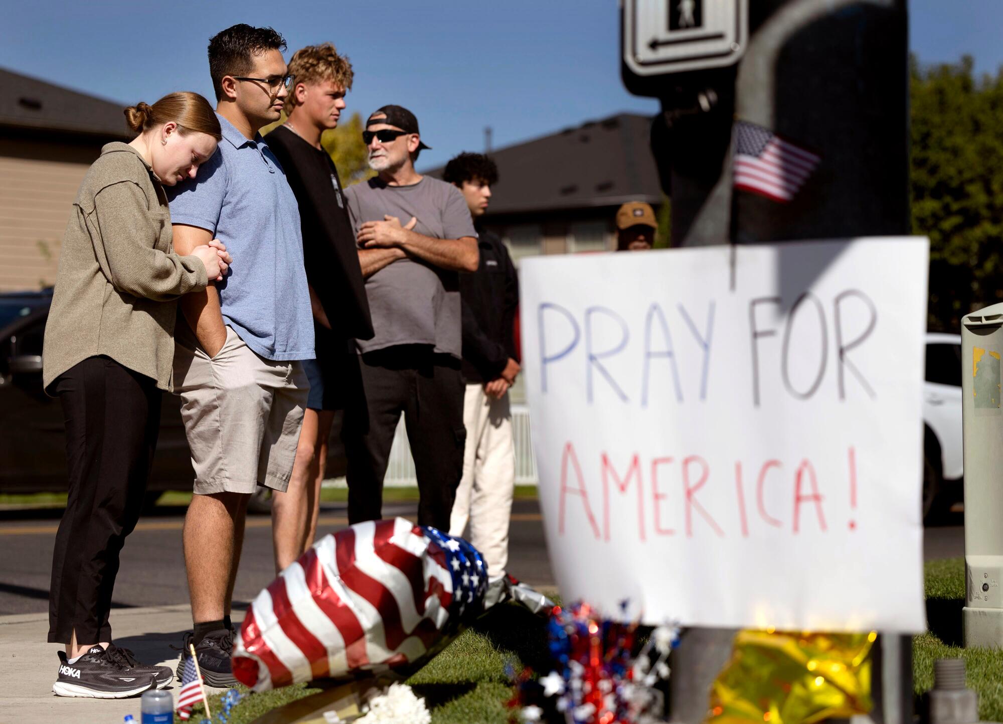 People visit a memorial honoring Charlie Kirk at Timpanogos Regional Hospital in Orem, Utah, on Sept. 11.