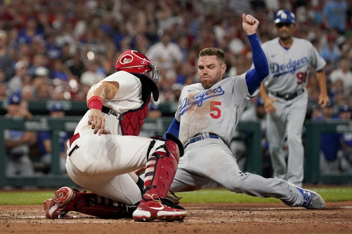 Freddie Freeman is tagged out at home by St. Louis Cardinals catcher Andrew Knizner.