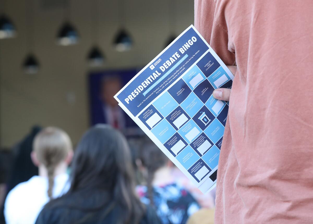 A bingo card was used at Tuesday night's watch party to critically identify examples of tactics that make politics personal.