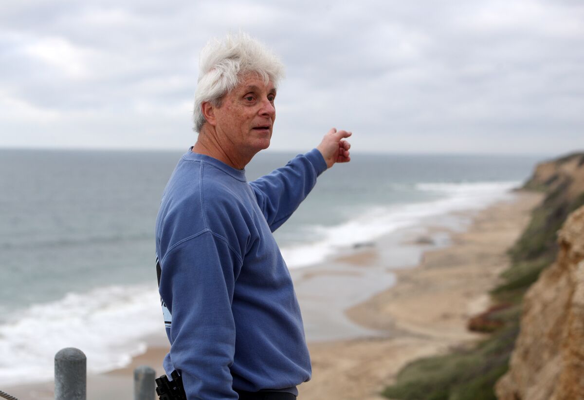 Rick Boufford points out the territory of three pairs of ravens at Crystal Cove State Park.