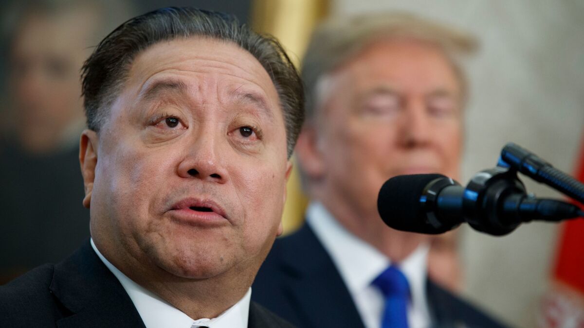 FILE - In this Thursday, Nov. 2, 2017, file photo, Broadcom CEO Hock Tan speaks as President Donald Trump listens during an event to announce the company is moving its global headquarters to the United States.