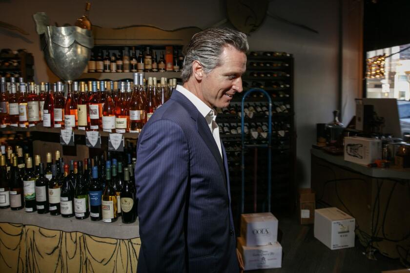 SAN FRANCISCO,CA --THURSDAY, JUNE 15, 2017--Lt. Gov. Gavin Newsom stops by Plumpjack Wines and Spirits, the store he opened in 1992 in the Marina district of San Francisco, while walking the Marina neighborhood where he lived for a good amount of his childhood, photographed, June 15, 2017. Newsom is a 2018 democratic candidate for California governor. (Jay L. Clendenin / Los Angeles Times)