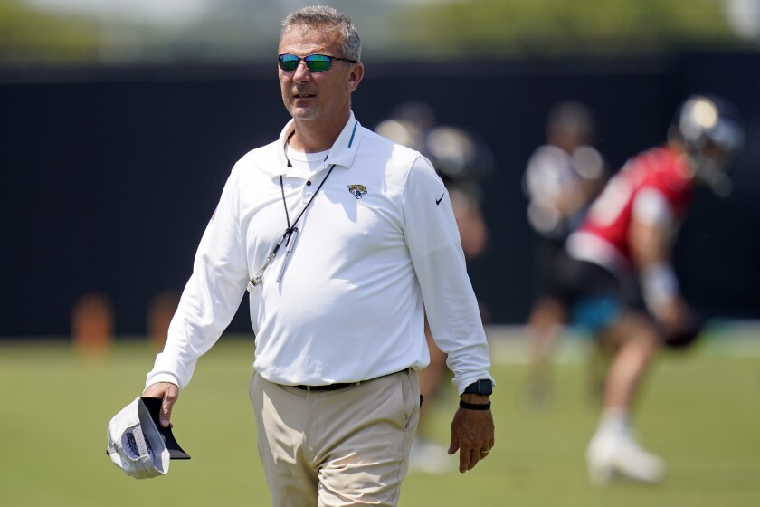 Jacksonville Jaguars head coach Urban Meyer watches players go through drills during an NFL football team practice, Thursday, May 27, 2021, in Jacksonville, Fla. (AP Photo/John Raoux)