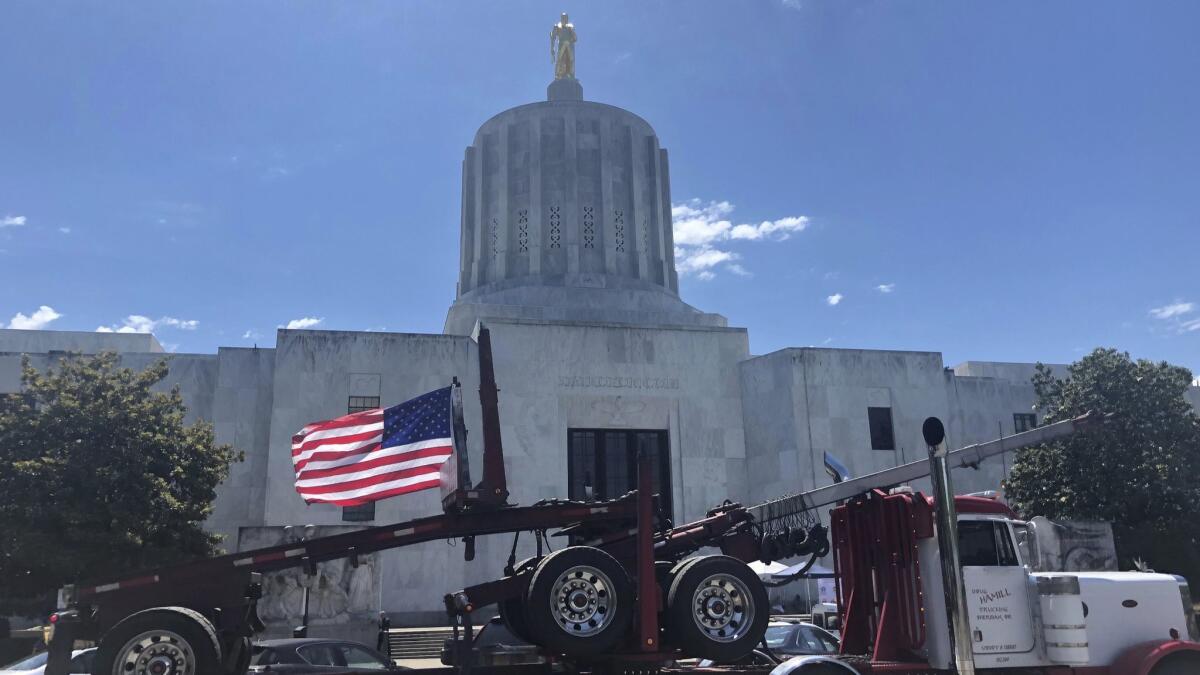A truck outside the Oregon Capitol in Salem joins a protest against climate bills on June 12. Truckers say the legislation would put them out of business.
