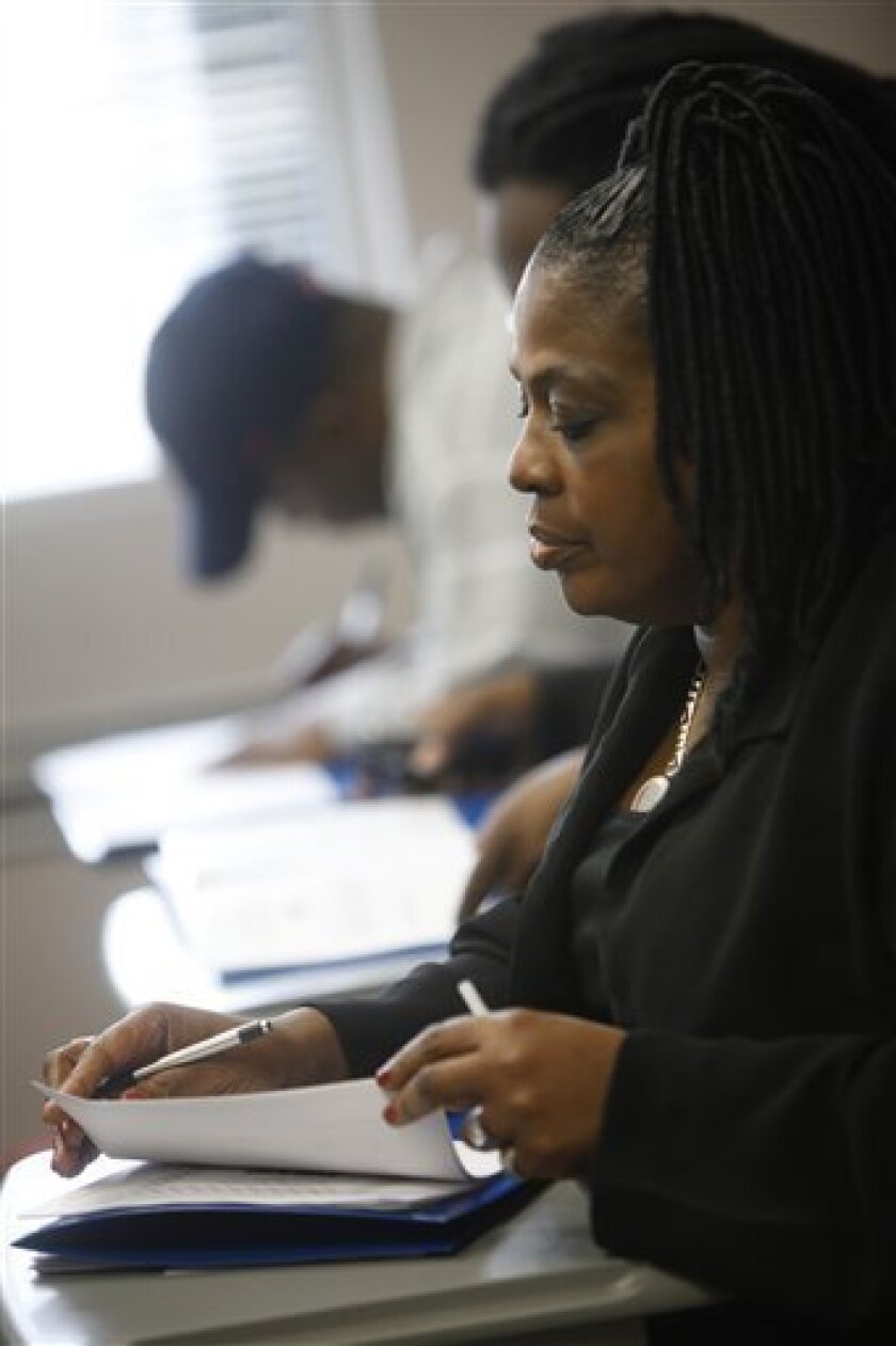 Carolyn Lindsey, 47, of Washington, attends a preparatory class at an unemployment center in Washington, on Monday, March 16, 2009. The Labor Department said Wednesday, April 1, all 372 metropolitan areas tracked saw their jobless rates rise in February from a year earlier. (AP Photo/Jacquelyn Martin)