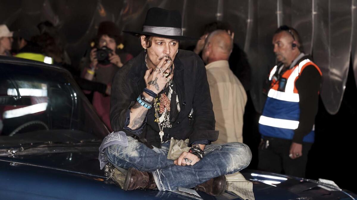 Johnny Depp waits to introduce one of his films at the Glastonbury Festival on Thursday.