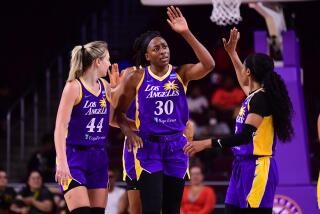 LOS ANGELES, CA - AUGUST 23: Nneka Ogwumike #30 of the Los Angeles Sparks high fives.