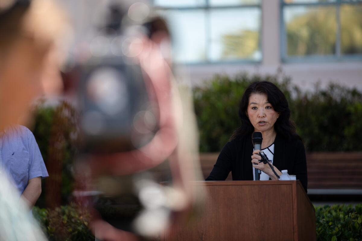 Sunny Rickard, president of Alliance of Chinese Americans San Diego, speaks during a press conference.