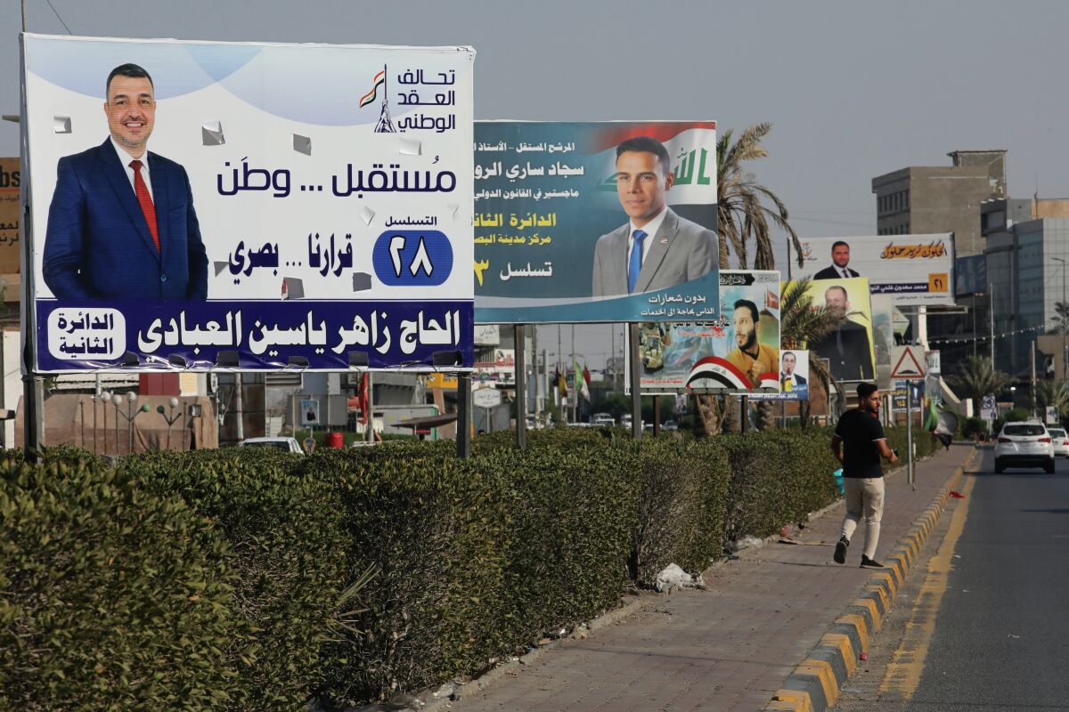 Campaign posters for upcoming early parliamentary elections are displayed in central Basra, Iraq, Friday, Oct. 1, 2021. The candidates know convincing Iraq's disillusioned youth to trust in an electoral process tainted with a history of tampering and fraud is their best chance to win seats. (AP Photo/Nabil al-Jurani)