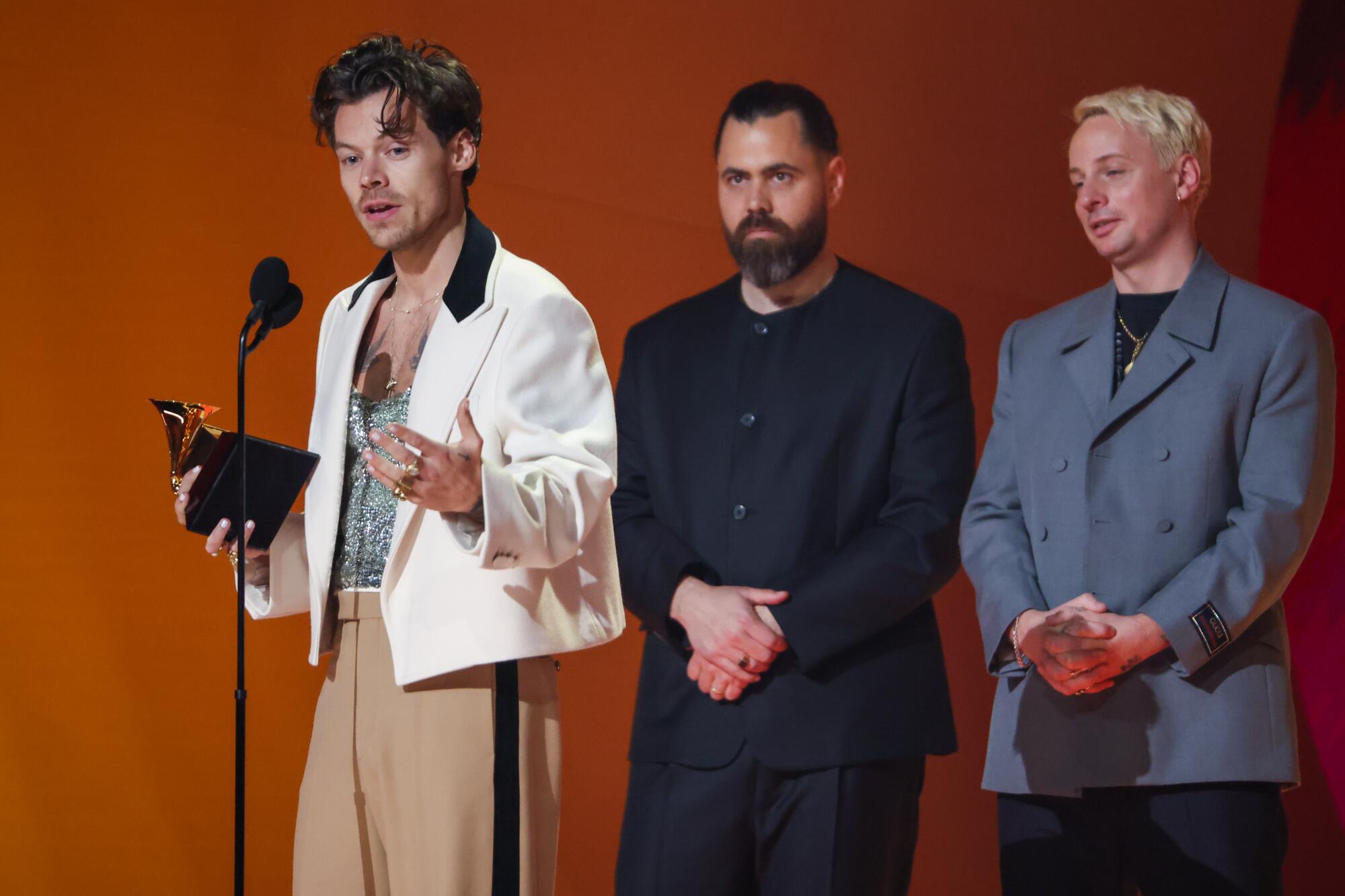 Harry Styles accepts the award for album of the year at the 65th Grammy Awards.