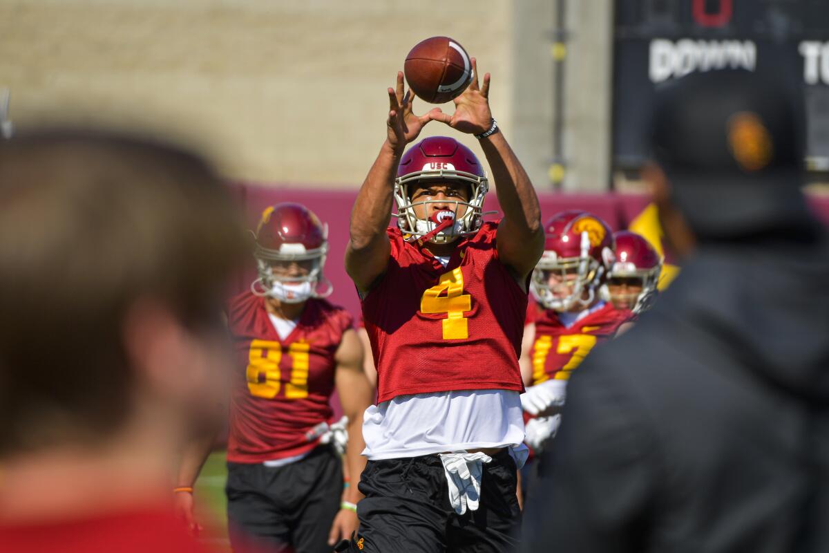 USC wide receiver Bru McCoy catches a pass during a team practice session.
