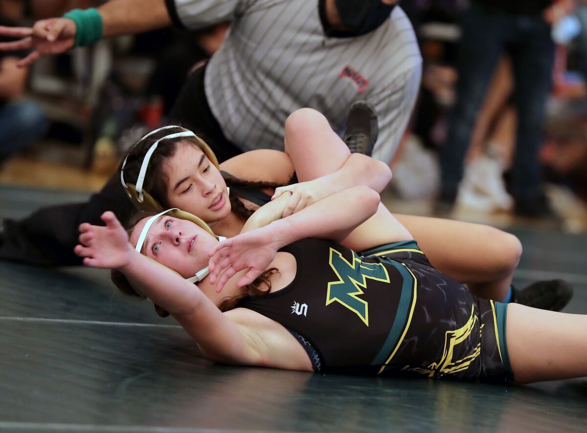Del Norte High's Brianna Busse, fresh off the cross-country season, is ready to hit the wrestling mat. 