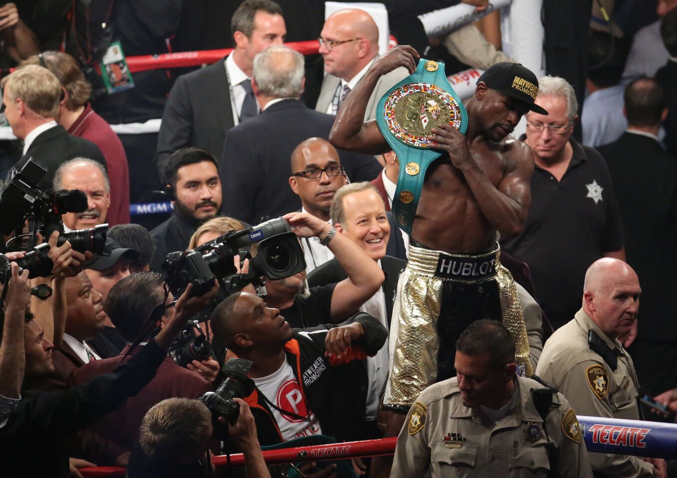 Floyd Mayweather Jr. holds up the belt after defeating Manny Pacquiao for the WBC welterweight championship Saturday at the MGM Grand Garden Arena.