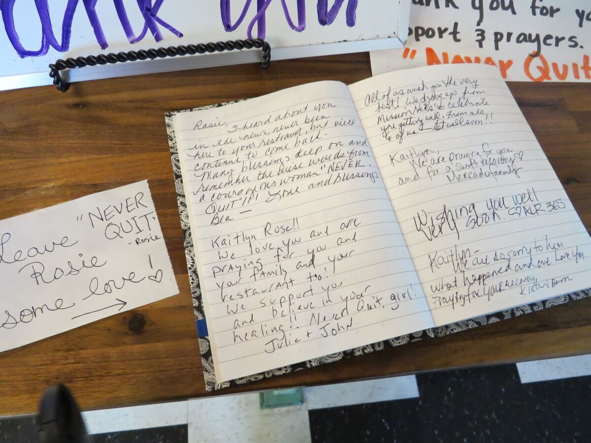 A journal near the cash register at Rosie's Cafe in Escondido on Monday is filled with hand-written notes of support from customers for cafe owner Kaitlyn Rose Pilsbury, 33, who was seriously injured Dec. 21 in a hit-and-run accident.