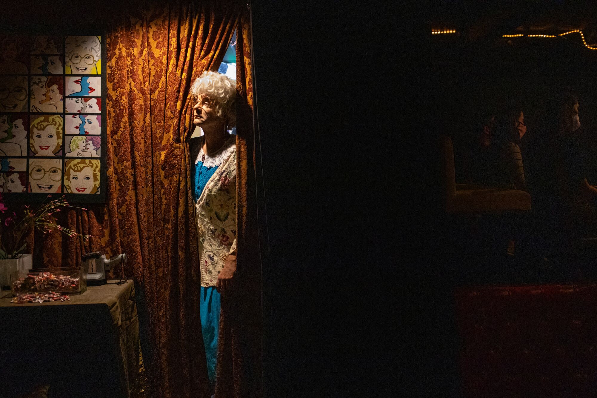 Sam Pancake, who played Sophia Petrillo, looks out from the curtain  backstage.