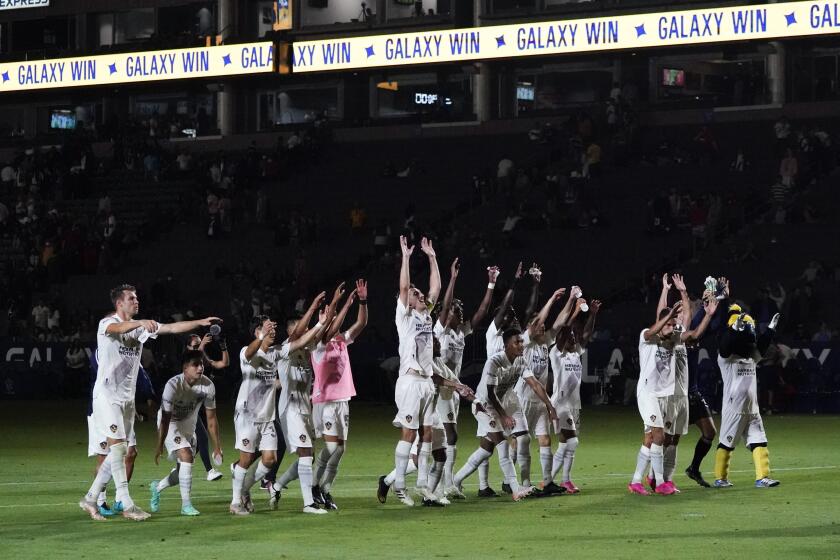 LA Galaxy celebrates a 3-1 win over FC Dallas after their MLS soccer game Wednesday, July 7, 2021, in Carson, Calif. (AP Photo/Ashley Landis)
