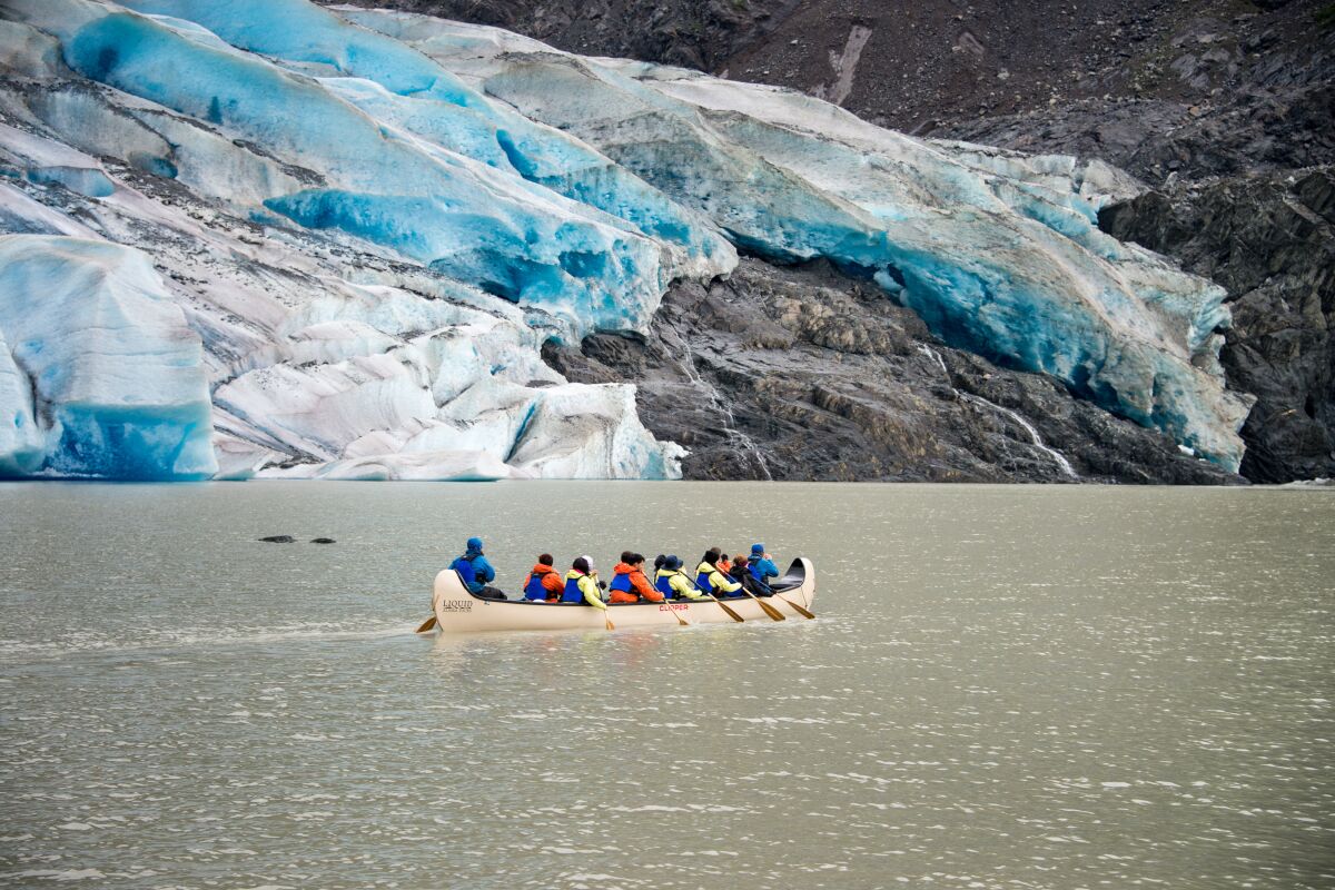 Canoers paddling to the foot of Mendenhall Glacier.