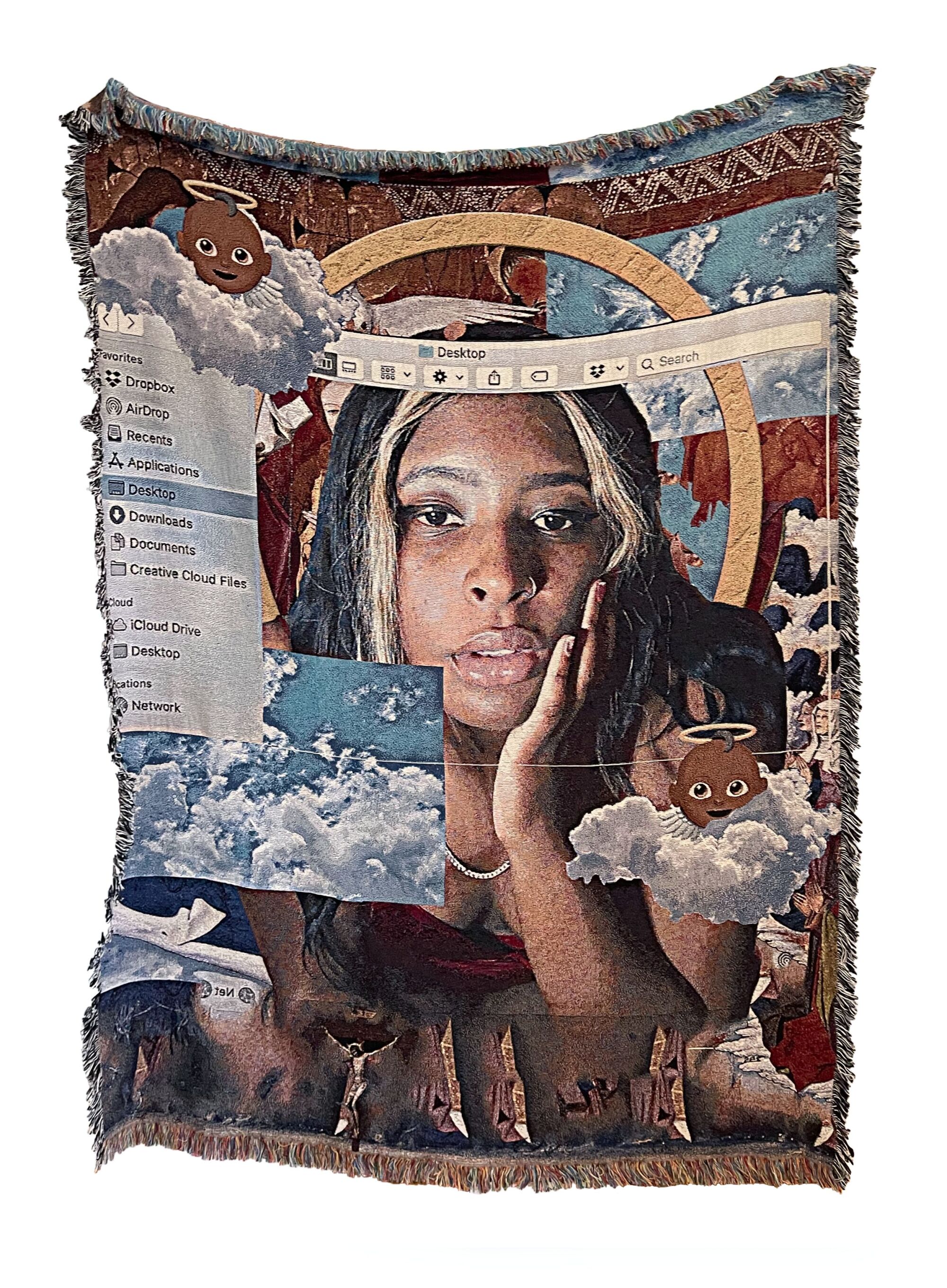 A blanket printed with images of a woman's face, emojis of baby angels and a computer screen