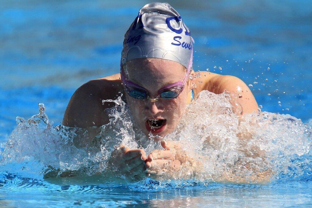 Corona del Mar High's Meagan Popp competes in the girls' 200-yard individual medley during a Pacific Coast League swim meet against University in Irvine on Tuesday.