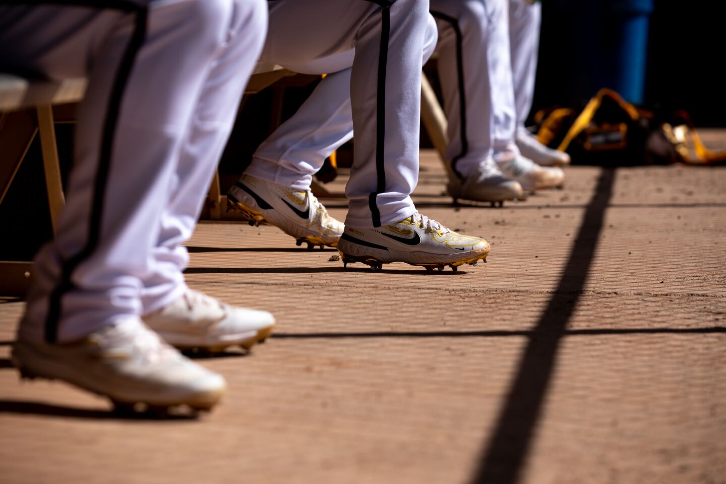 Padres players sit in the dugout during a spring training practice at the Peoria Sports Complex on Monday, Feb. 20, 2023 in Peoria, AZ.