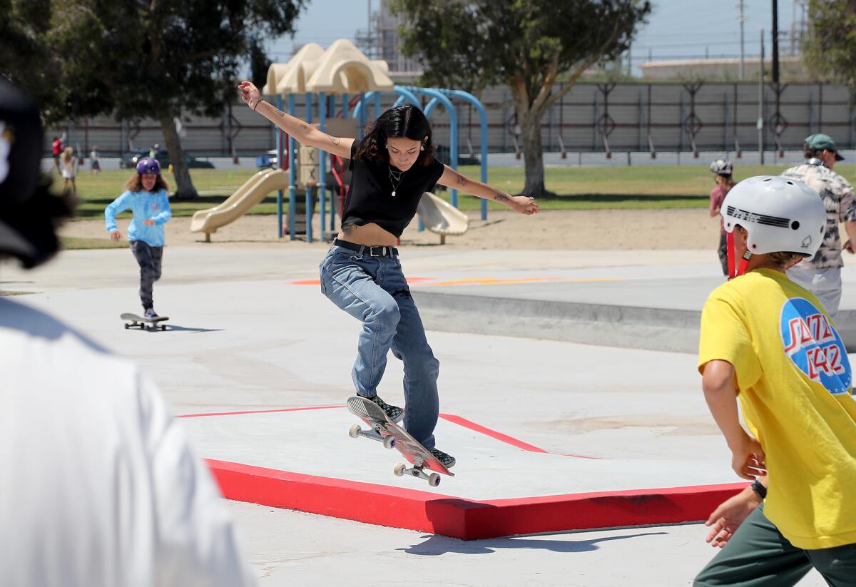 Alyssa Whitson, 21, ollies a curb at the new Edison Park Skate Spot on Thursday in Huntington Beach.