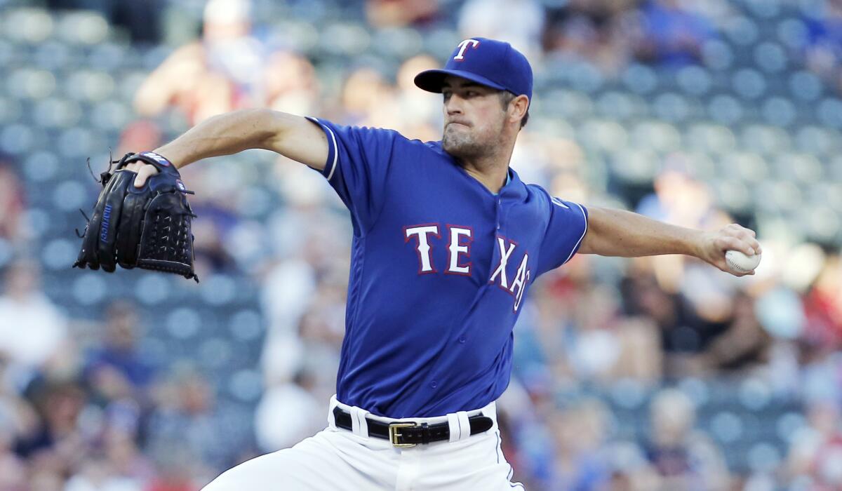 Texas' Cole Hamels pitches against Houston Astros on June 7.