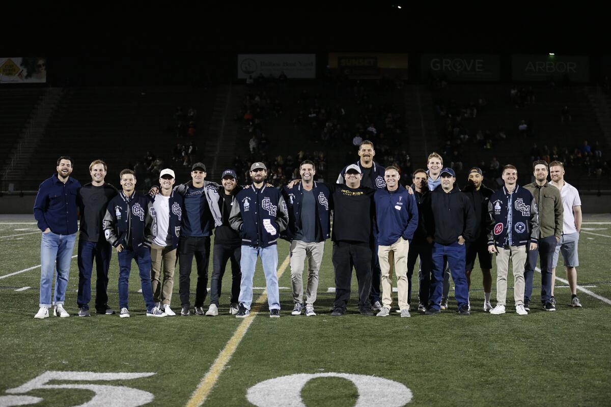 Members of Corona del Mar's 2011 CIF title team are honored on the field at halftime Friday.