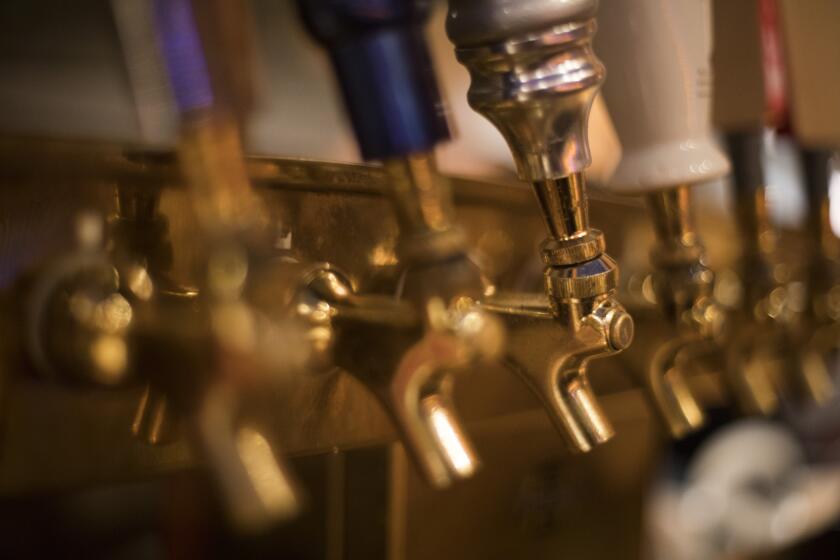 This Dec. 25, 2018, photo shows beer taps at a bar at the Back Bowl bowling alley in Eagle, Colo. (AP Photo/Jenny Kane)