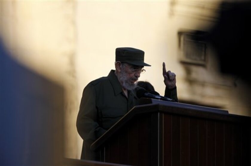 Cuba's leader Fidel Castro delivers a speech to students outside Havana's University in Havana, Cuba, Friday, Sept. 3, 2010. Castro dusted off his military fatigues for the first time since stepping down as president four years ago, a symbolic act in a Communist country where little signals often carry enormous significance. (AP Photo/Javier Galeano)