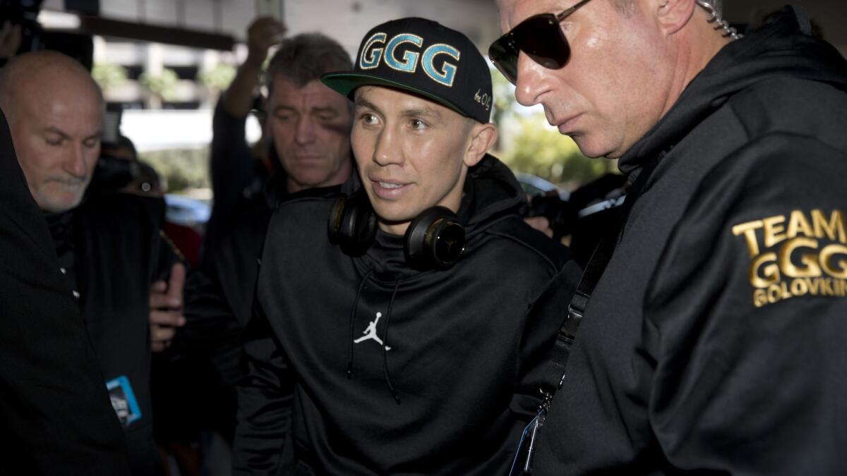 WBC/WBA middleweight champion Gennady Golovkin, center, arrives at the MGM Grand hotel-casino in Las Vegas on Tuesday.