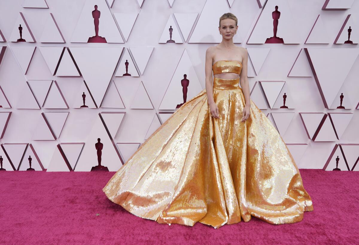 Carey Mulligan in a gold gown on the Oscars red carpet