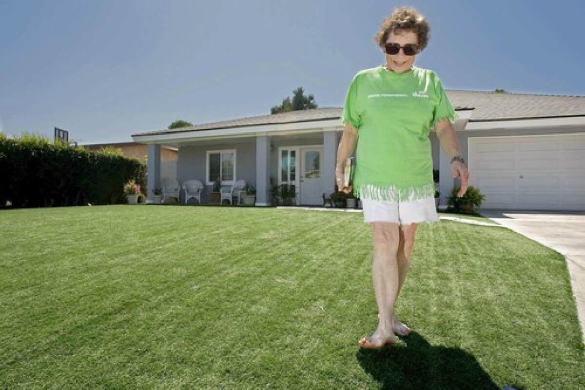 Jean Orban loves the soft texture of the artificial turf that covers the front yard of her Garden Grove home from curb to porch. She had it installed for the beauty and zero maintenance.