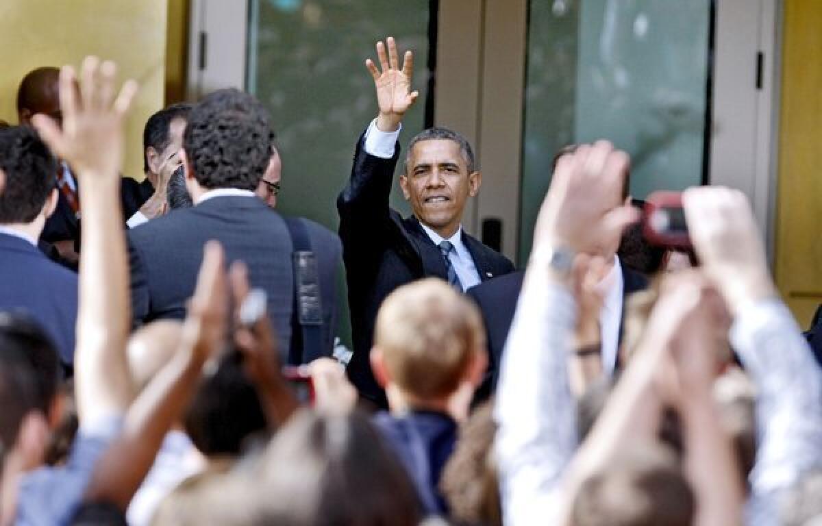 President Barack Obama waves goodbye to the crowd after speaking for about half hour at DreamWorks in Glendale on Tuesday, Nov. 26, 2013.