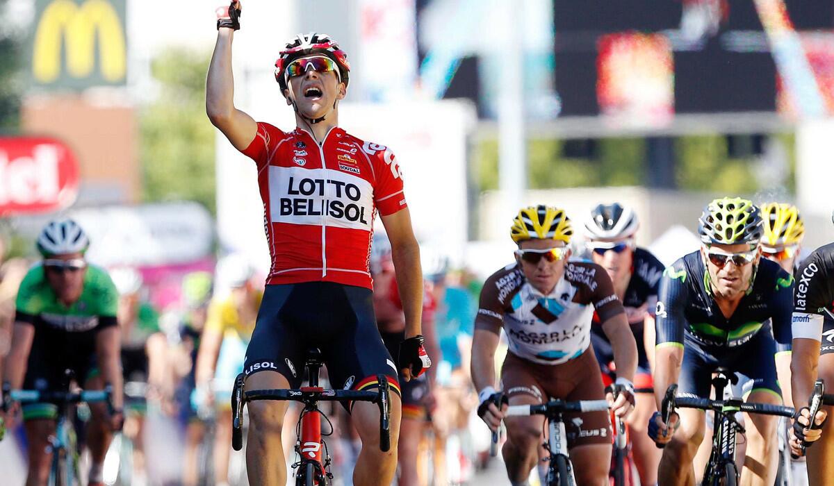Tony Gallopin celebrates after holding off a chase pack to win the 11th stage of the Tour de France on Wednesday in Oyonnax, France.