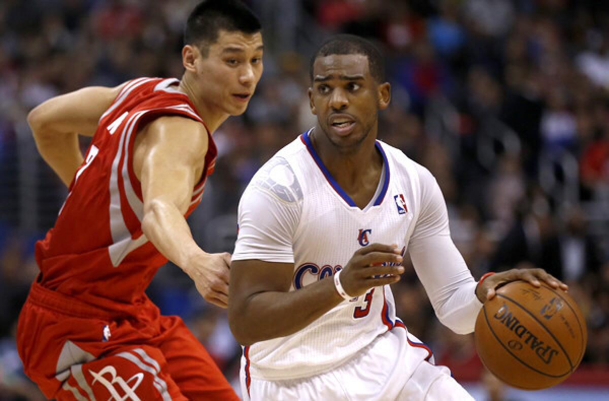 Clippers point guard Chris Paul drives past Rockets point guard Jeremy Lin during a game last month at Staples Center.