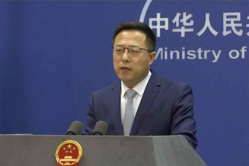 FILE - In an image taken from video, Chinese Foreign Ministry spokesperson Zhao Lijian speaks during a media briefing Thursday, March 10, 2022, in Beijing. India's power sector has been targeted by hackers in a long-term operation thought to have been carried out by a state-sponsored Chinese group, a U.S.-based private cybersecurity company detailed in a new report. China's Foreign Ministry spokesman Zhao said Thursday, April 7, the report had been “noted” by Beijing, but that China “firmly opposes and combats any form of cyber attacks, and will not encourage, support or condone any cyber attacks.” (AP Photo, File)