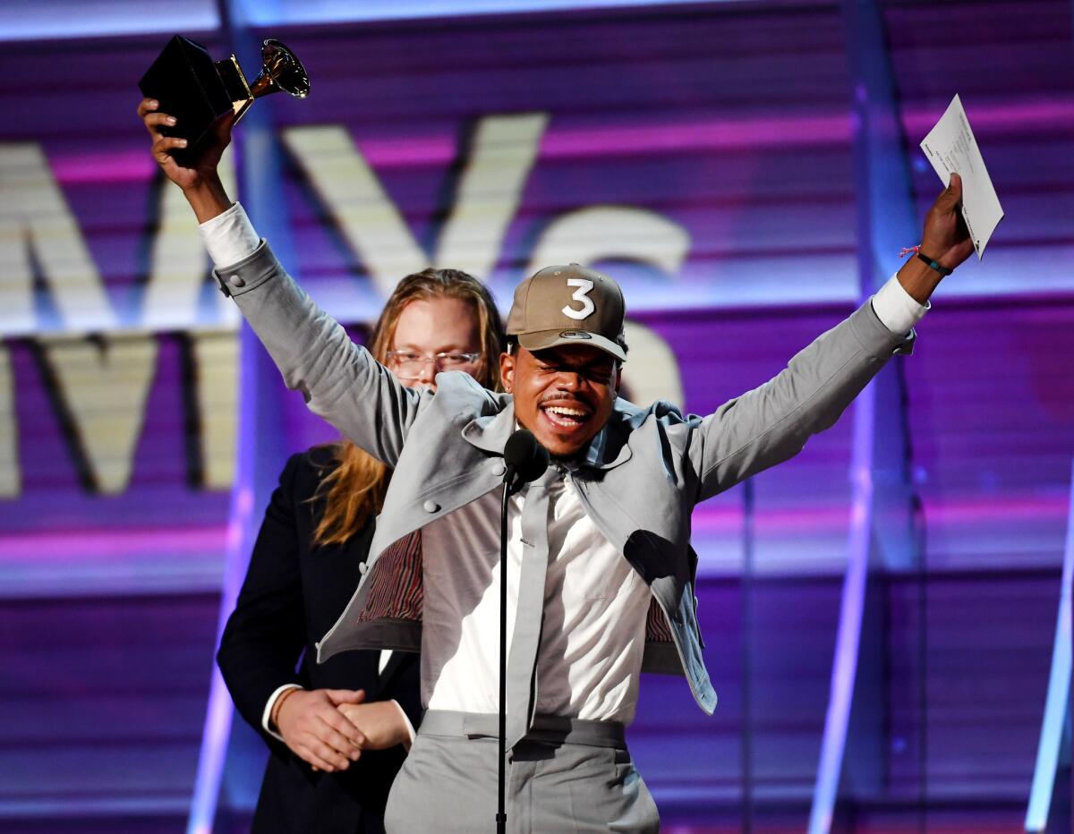 Chance the Rapper accepts the award for rap album onstage during the 59th Grammy Awards