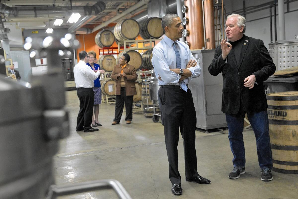 President Obama visits an innovation center at Cleveland State University with Tom Lix, chief executive of Cleveland Whiskey.