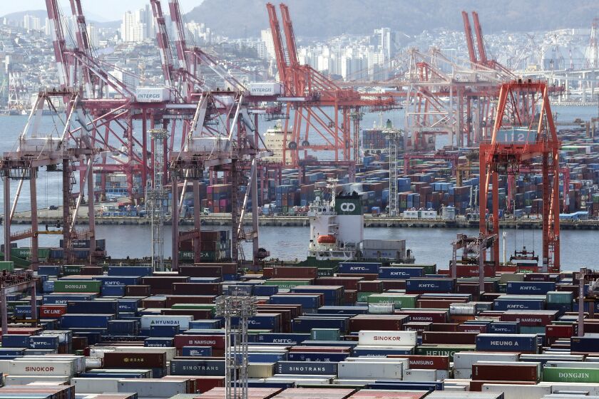 Containers are seen at the country's largest port, in Busan, South Korea, on Jan. 10, 2023. South Korea logged its biggest monthly trade deficit ever, at $12.7 billion in January, as exports of computer chips and other high-tech items sank and costs for importing oil and gas surged, the trade ministry said Wednesday, Feb. 1, 2023. (Kang Duck-chul/Yonhap via AP)