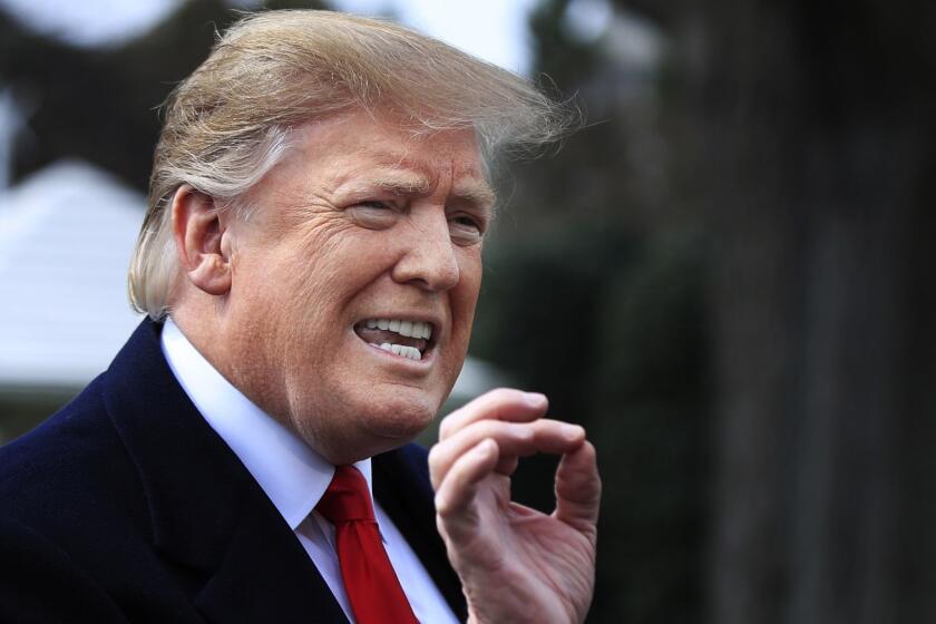 In this March 20, 2019, photo, President Donald Trump speaks to reporters before leaving the White House in Washington. The end of the special counsel?s investigation sparked fresh speculation that Trump might pardon some of those charged in the probe. It?s also spawned a don?t-go-there chorus from a number of Trump?s closest advisers and GOP allies. (AP Photo/Manuel Balce Ceneta)