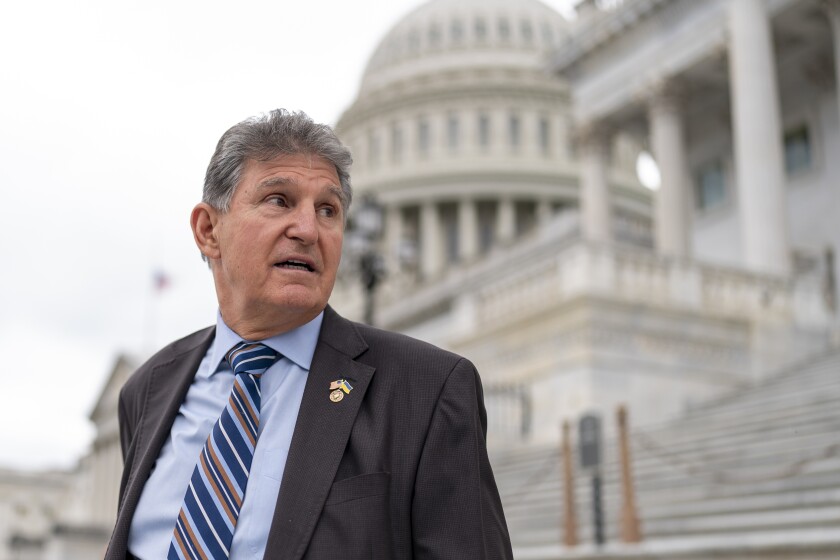 Sen. Joe Manchin, D-W.Va., seen on the steps of the Capitol in May.