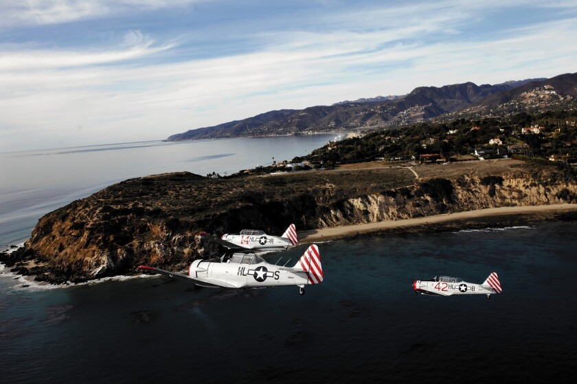 Pilots of the Condor Squadron fly in formation off Malibu near Point Dume. The group and its members own eight AT-6/SNJ Texans, one of the largest collections in the country.