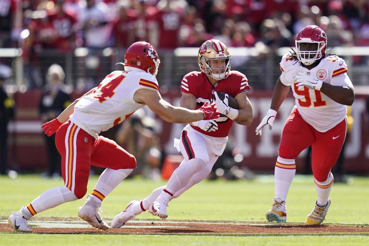 San Francisco 49ers running back Christian McCaffrey carries the ball against the Kansas City Chiefs.