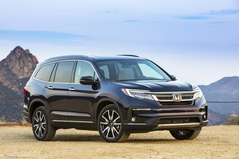 This photo provided by Honda shows the 2022 Honda Pilot, a midsize three-row SUV that gets better fuel economy than most of its rivals. (Courtesy of American Honda Motor Co., Inc. via AP)