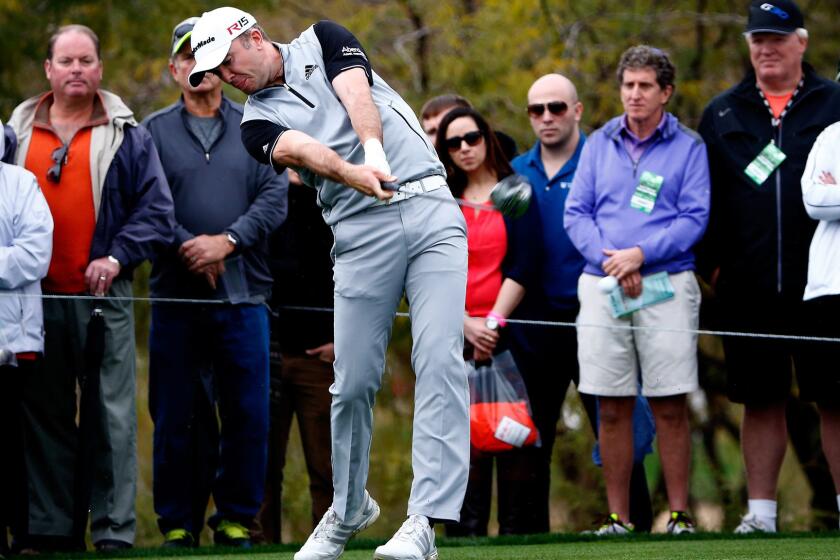 Martin Laird tees off on the ninth hole during the third round of the Phoenix Open on Saturday.