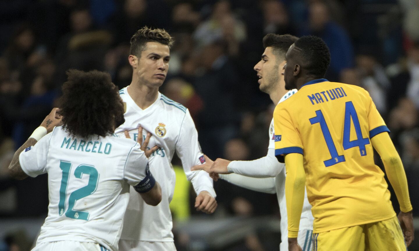 Real Madrid's Portuguese forward Cristiano Ronaldo (2L) confronts Juventus' French midfielder Blaise Matuidi (R) during the UEFA Champions League quarter-final second leg football match between Real Madrid CF and Juventus FC at the Santiago Bernabeu stadium in Madrid on April 11, 2018. / AFP PHOTO / CURTO DE LA TORRECURTO DE LA TORRE/AFP/Getty Images ** OUTS - ELSENT, FPG, CM - OUTS * NM, PH, VA if sourced by CT, LA or MoD **